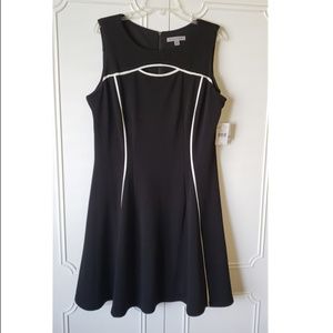 Sleeveless black dress with white trim